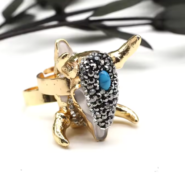 ANILLO TORO CHAPADO EN ORO 18 KILATES CON CRISTALES Y TURQUESA